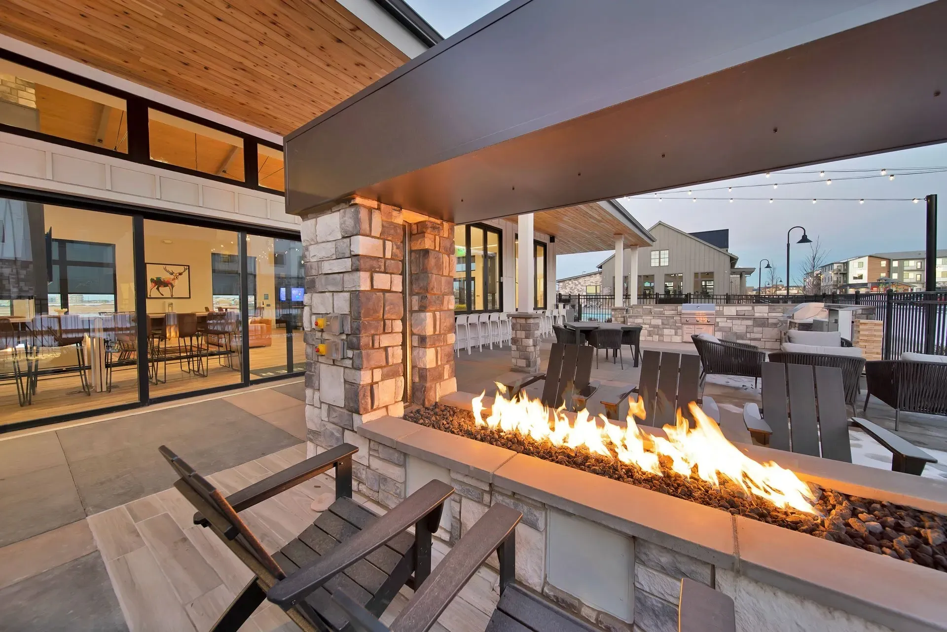 Camber Apartments outdoor patio and fire pit at dusk