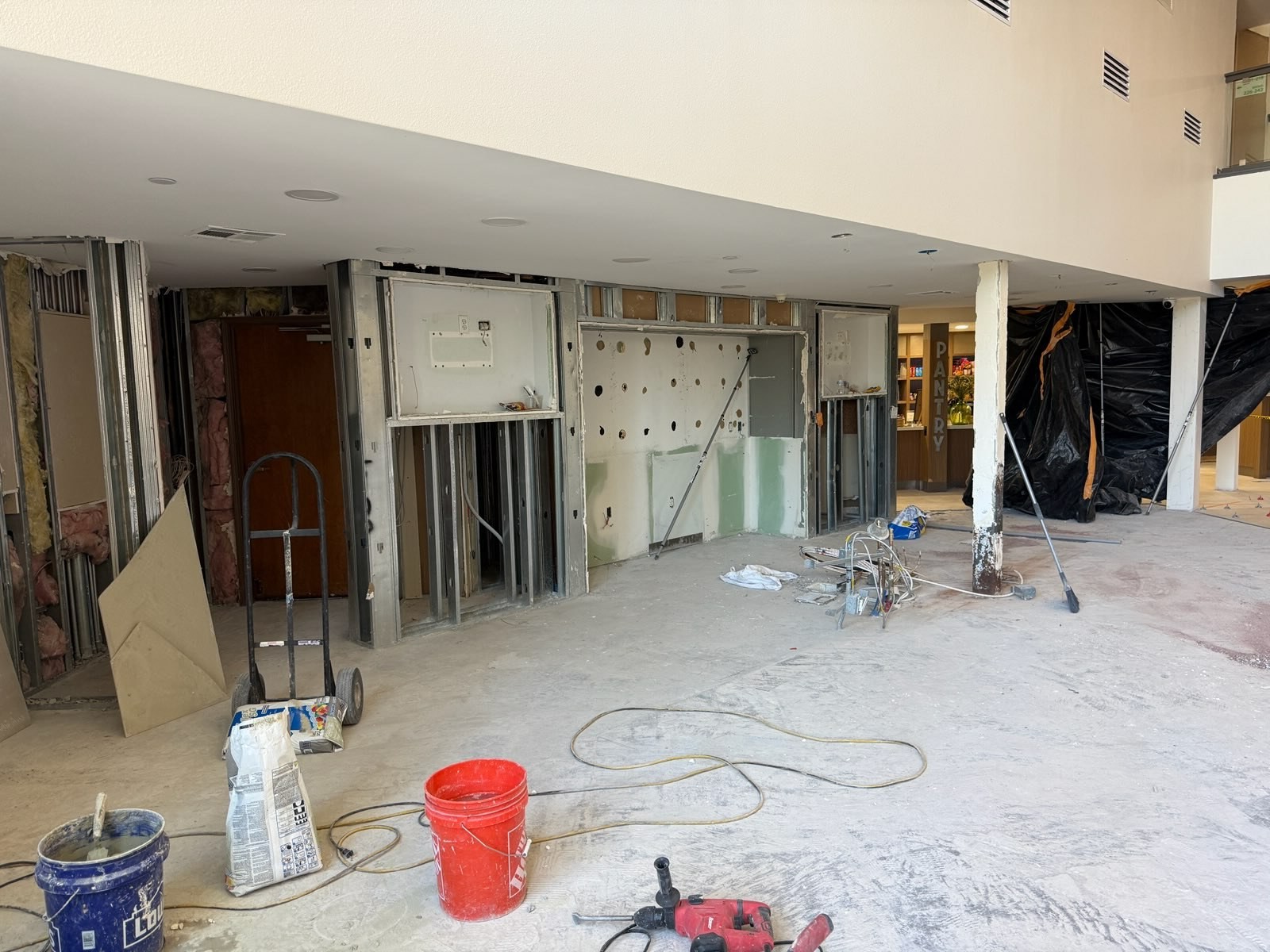 Holiday Inn Ocotillo lobby with walls opened and finishes removed during renovation