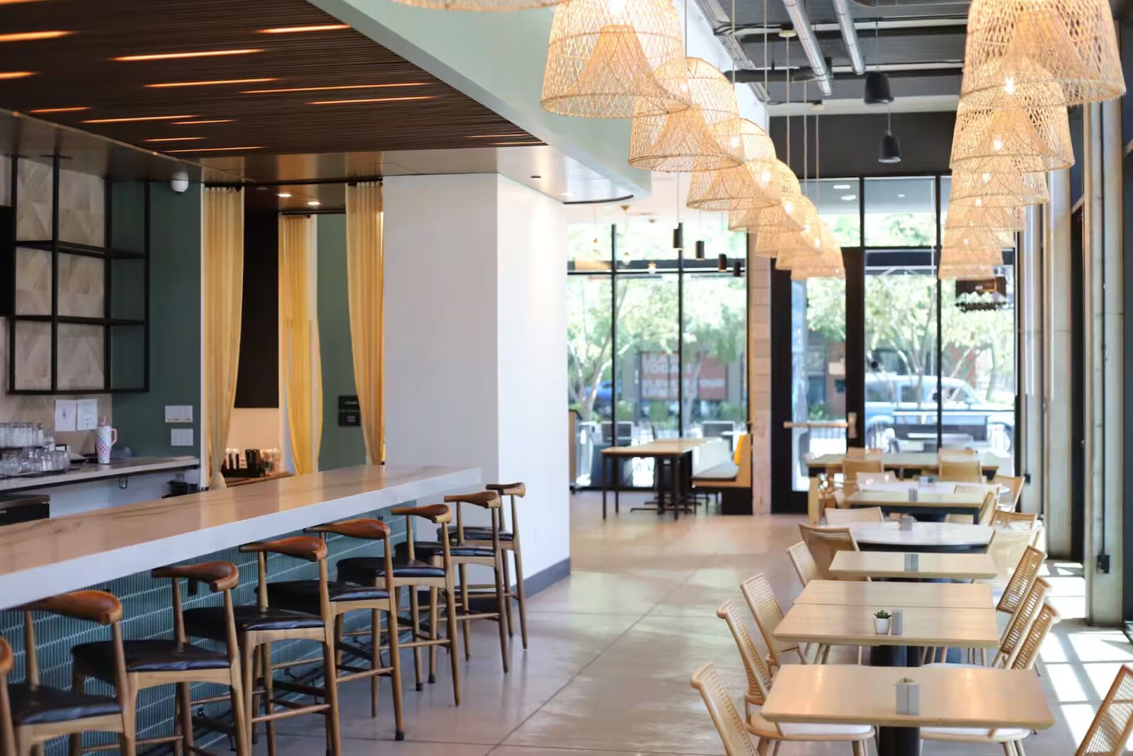 Dining room at Palette, with woven pendants over the bar